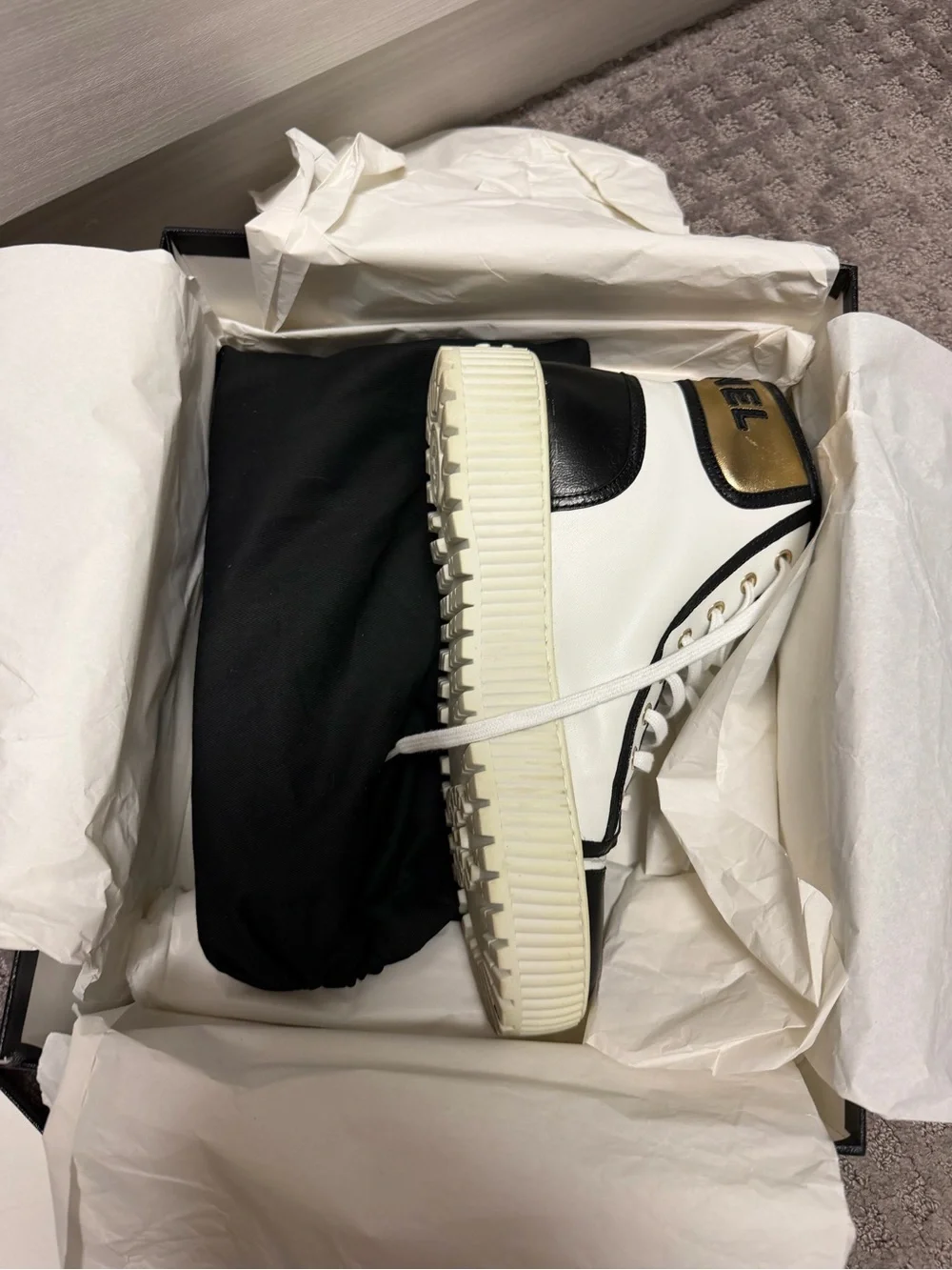 CHANEL White and Black High-Top Logo Sneaker